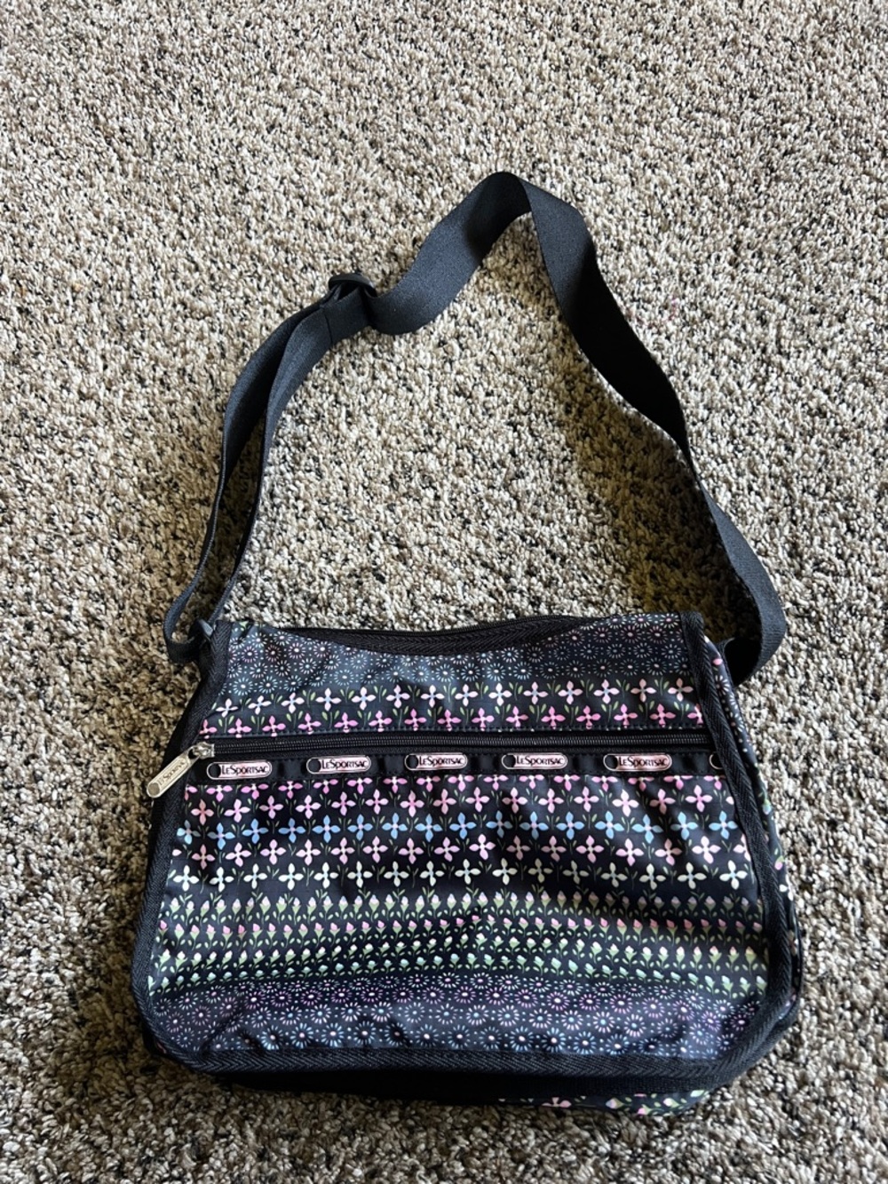 Lesportsac Black Crossbody Bag with Pink, Purple and Green Pattern